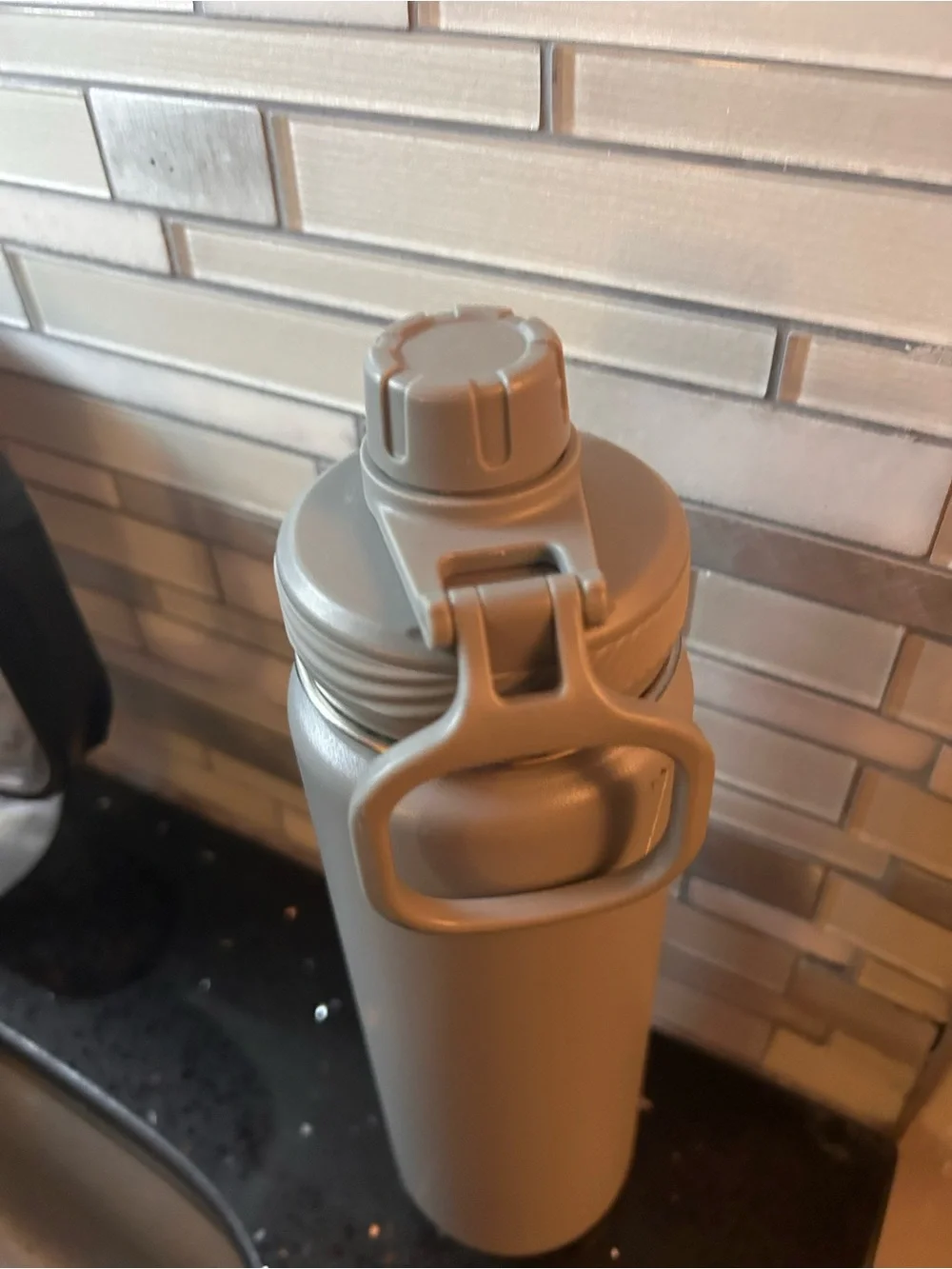 One gray lululemon water bottle metal screw on cap 120z
